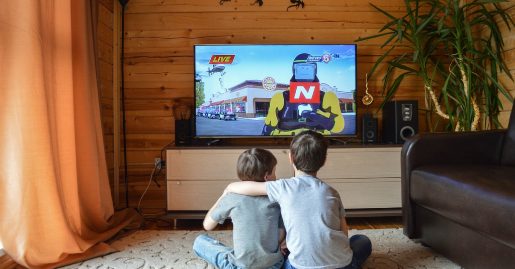 Child watching TV highlighting screen time habits and entertainment.