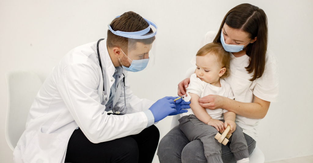 A pediatrician administering a vaccine to a baby, highlighting the importance of staying up-to-date with the 2024 baby immunization schedule.