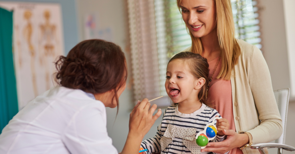 A pediatrician examining a smiling child during a routine health check-up, emphasizing the importance of pediatric care in India for healthy development.